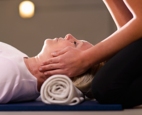Woman being treated with Reiki
